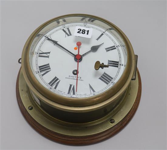 A Smiths brass bulkhead eight day timepiece